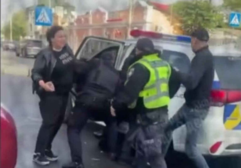 Ukrainian police choke woman unconscious (Video)